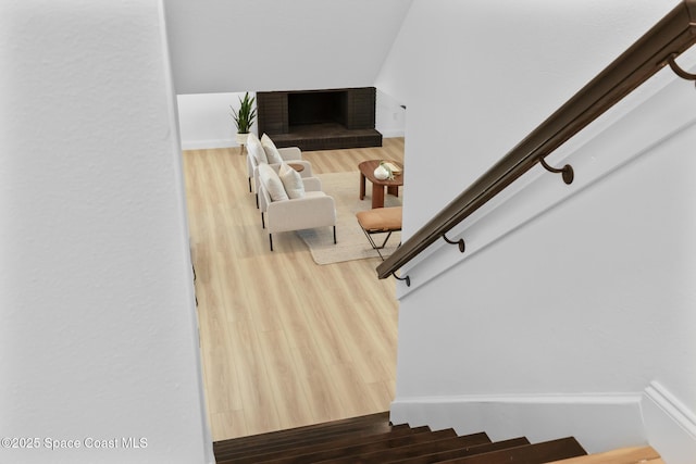staircase with wood finished floors