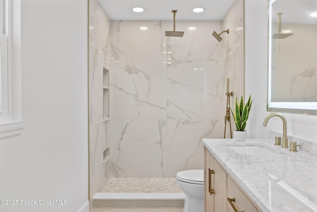 full bath featuring toilet, vanity, a marble finish shower, and recessed lighting
