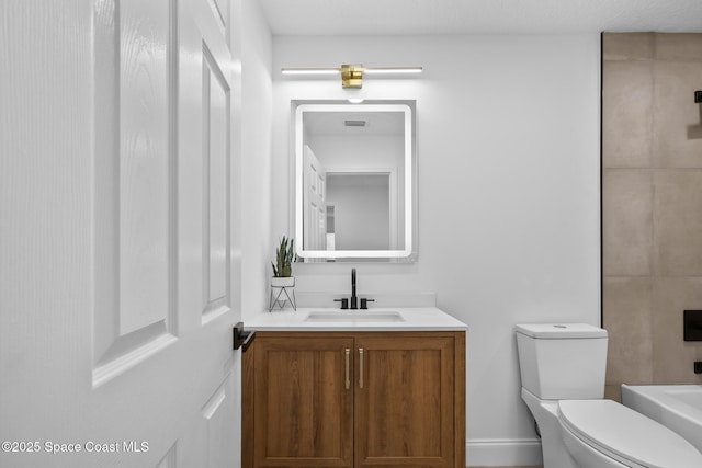 full bathroom featuring toilet and vanity
