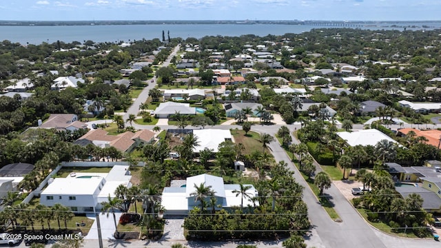 aerial perspective of suburban area featuring a nearby body of water