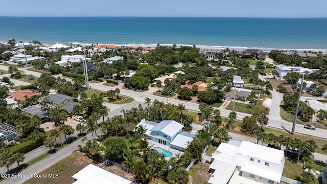 aerial view of residential area with a nearby body of water