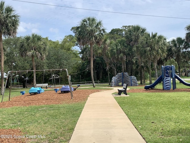 community play area with a lawn