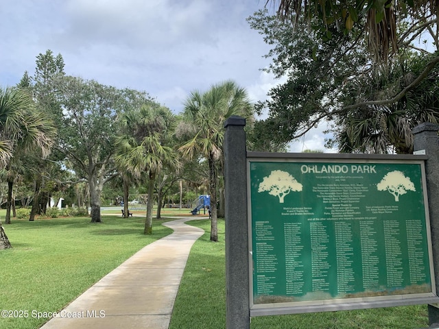 view of property's community with a yard
