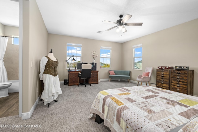 3631 Stabane Pl, Melbourne, FL 32940 - bedroom with baseboards, a desk, carpet flooring, a ceiling fan, and ensuite bath