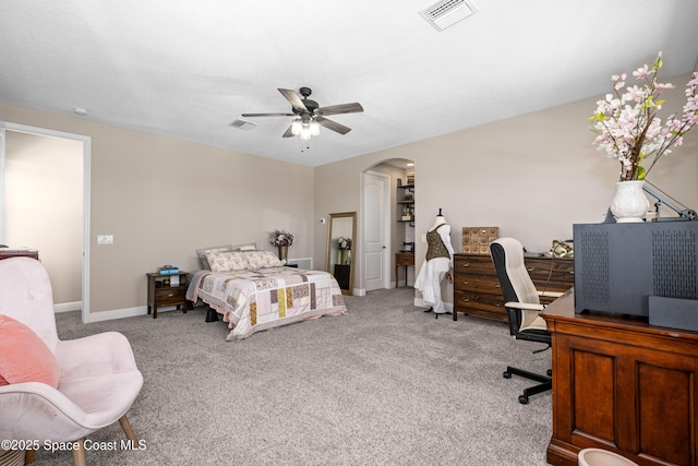 3631 Stabane Pl, Melbourne, FL 32940 - bedroom featuring arched walkways, carpet floors, an office area, baseboards, and a ceiling fan