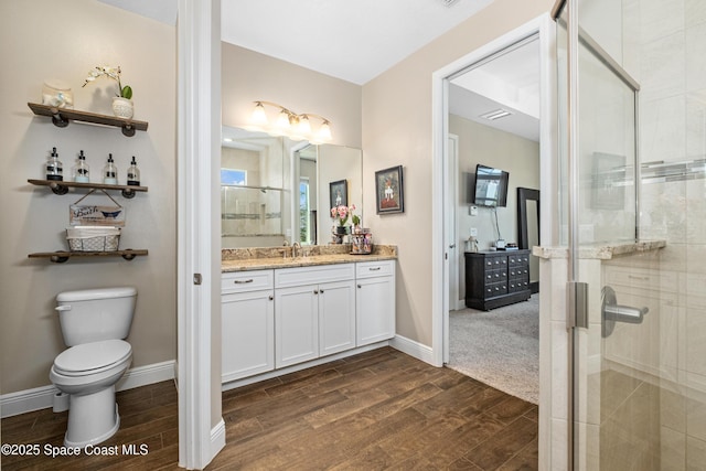 3631 Stabane Pl, Melbourne, FL 32940 - bathroom with wood finished floors, vanity, a shower stall, and toilet