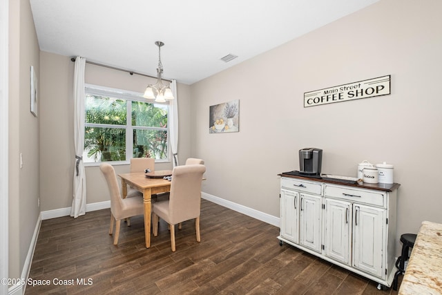 3631 Stabane Pl, Melbourne, FL 32940 - dining space with a chandelier, dark wood finished floors, and baseboards