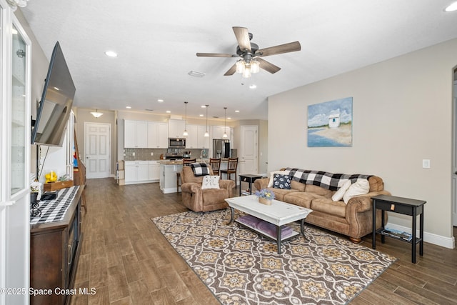 3631 Stabane Pl, Melbourne, FL 32940 - living area with wood finished floors, ceiling fan, recessed lighting, and baseboards