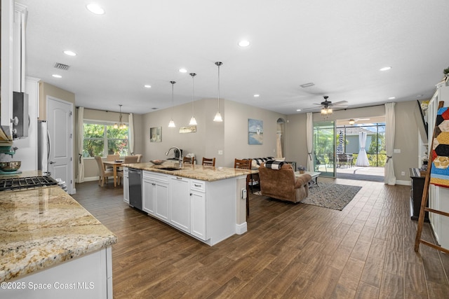 3631 Stabane Pl, Melbourne, FL 32940 - kitchen with a sink, recessed lighting, dark wood-style floors, white cabinetry, and open floor plan
