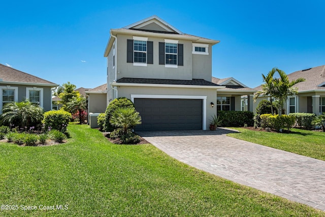 3631 Stabane Pl, Melbourne, FL 32940 - traditional home featuring stucco siding, a garage, a front lawn, and decorative driveway