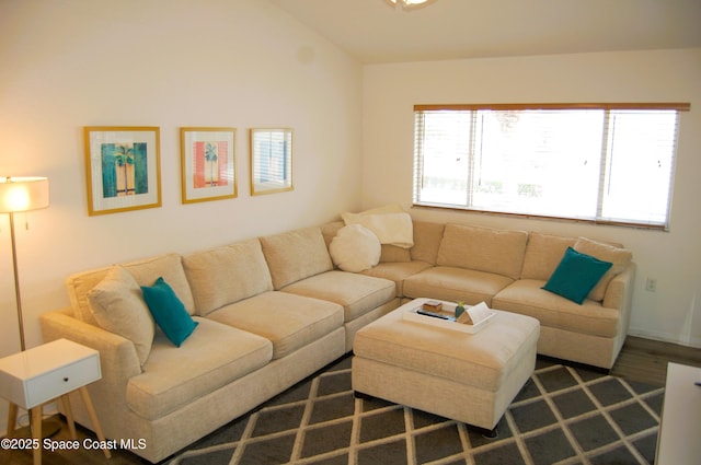 living area with vaulted ceiling