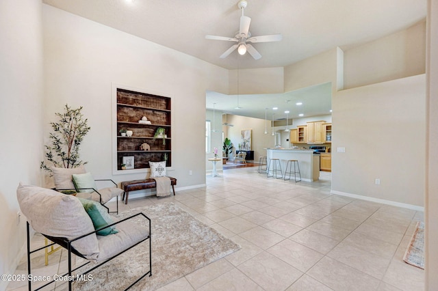 178 Cove Loop Dr, Merritt Island, FL 32953 - living area with a ceiling fan, built in shelves, light tile patterned flooring, recessed lighting, and baseboards