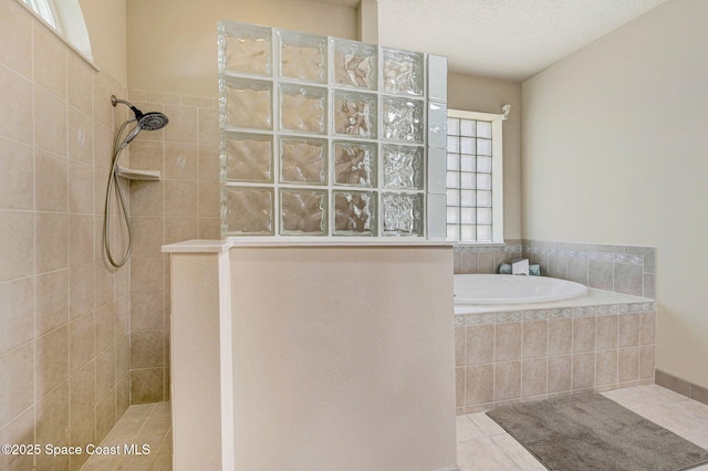 178 Cove Loop Dr, Merritt Island, FL 32953 - full bathroom with a walk in shower, tile patterned floors, and a garden tub