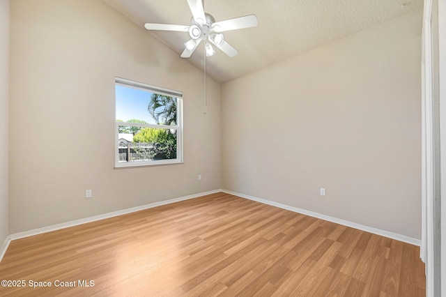 178 Cove Loop Dr, Merritt Island, FL 32953 - empty room with light wood finished floors, baseboards, lofted ceiling, and ceiling fan
