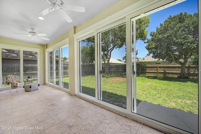 178 Cove Loop Dr, Merritt Island, FL 32953 - unfurnished sunroom with a textured ceiling