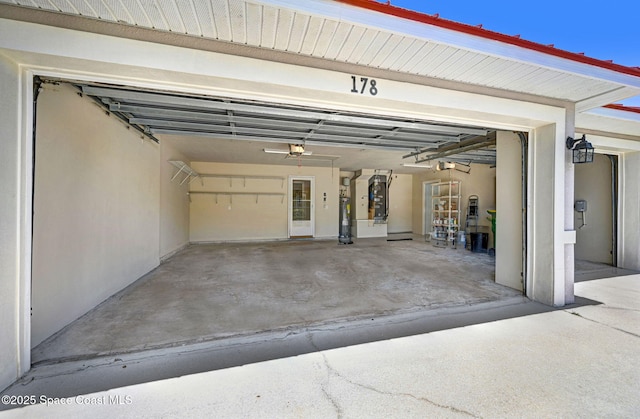 178 Cove Loop Dr, Merritt Island, FL 32953 - garage with water heater, a garage door opener, and heating unit