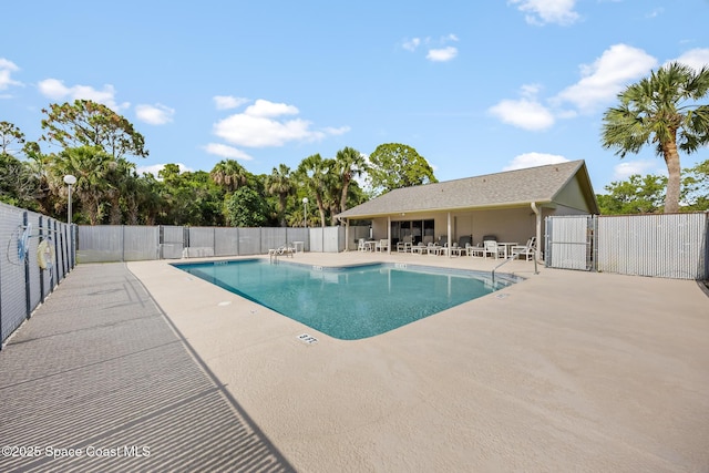 1411 Club Gardens Dr NE, Palm Bay, FL 32905 - community pool with a patio area, fence, and a gate