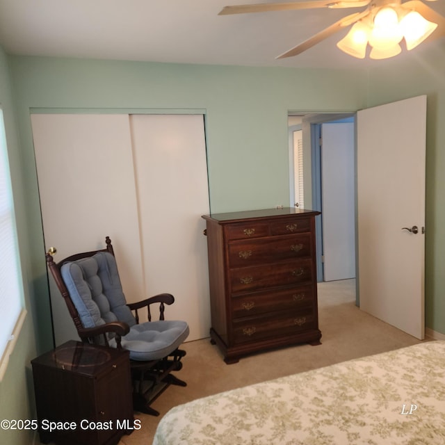 bedroom with light colored carpet, a closet, and ceiling fan