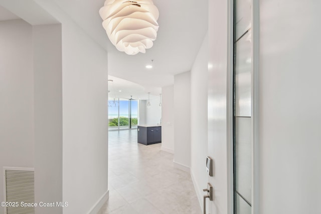 hallway featuring baseboards