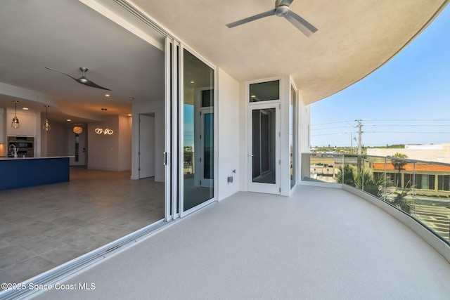 balcony featuring ceiling fan