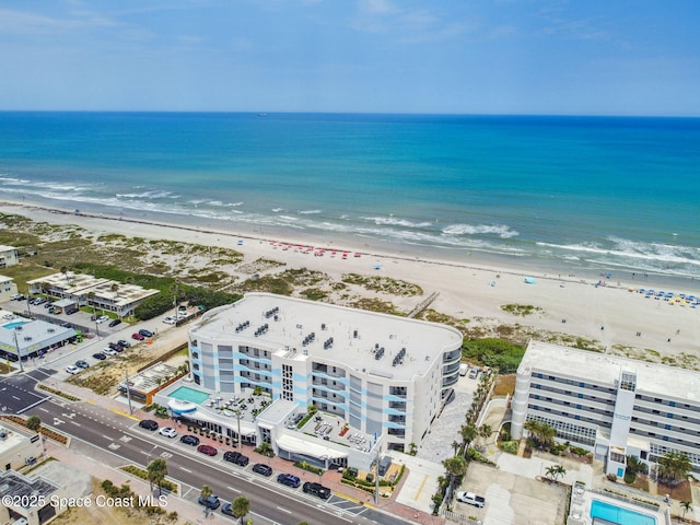aerial view of expansive beach and apartment complex / building