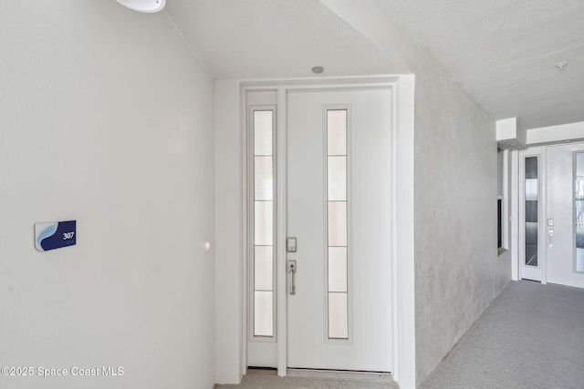 hall featuring carpet floors