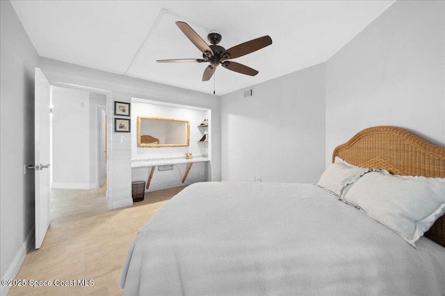 2203 Atlantic St Unit 715, Melbourne Beach, FL 32951 - bedroom with baseboards, ceiling fan, light tile patterned floors, and ensuite bath
