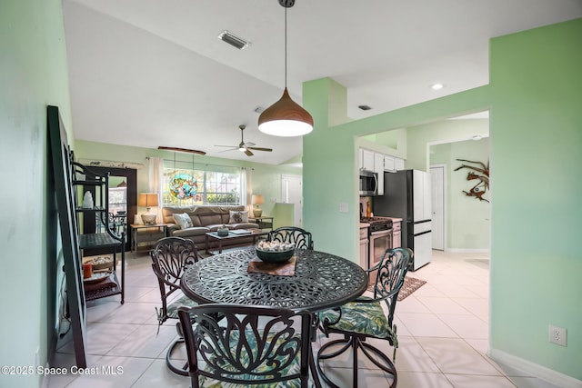 644 Sheridan Woods Dr, Melbourne, FL 32904 - dining space with a ceiling fan, light tile patterned floors, baseboards, and vaulted ceiling