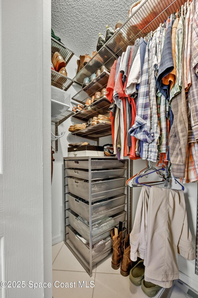 644 Sheridan Woods Dr, Melbourne, FL 32904 - walk in closet featuring tile patterned flooring