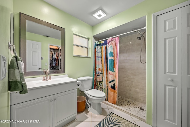 644 Sheridan Woods Dr, Melbourne, FL 32904 - full bathroom with tiled shower, a closet, tile patterned floors, and vanity