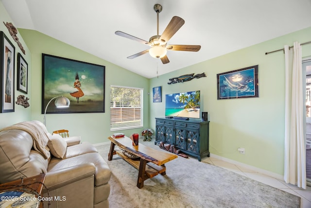 644 Sheridan Woods Dr, Melbourne, FL 32904 - tiled living room with vaulted ceiling, baseboards, and a ceiling fan