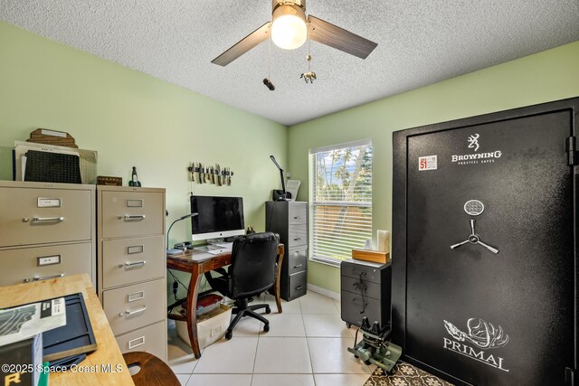 644 Sheridan Woods Dr, Melbourne, FL 32904 - home office featuring light tile patterned flooring, a textured ceiling, and ceiling fan