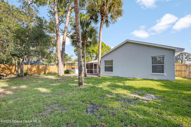 644 Sheridan Woods Dr, Melbourne, FL 32904 - view of yard with a sunroom