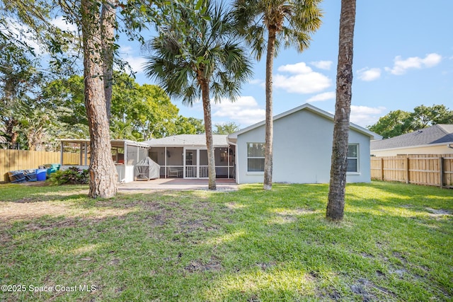 644 Sheridan Woods Dr, Melbourne, FL 32904 - rear view of house with a sunroom and stucco siding