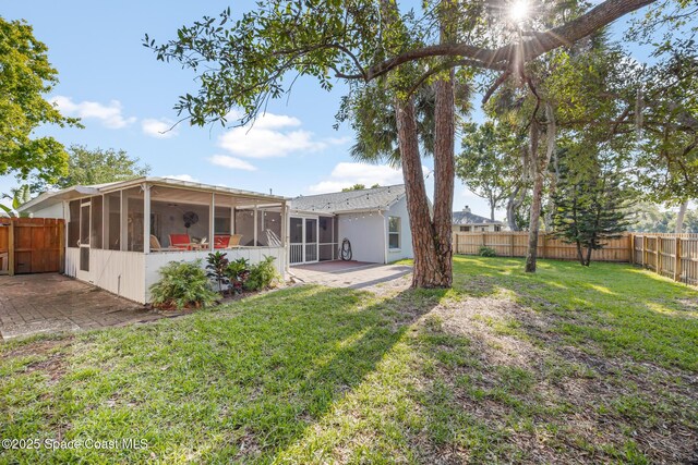 644 Sheridan Woods Dr, Melbourne, FL 32904 - back of property with a sunroom and a patio