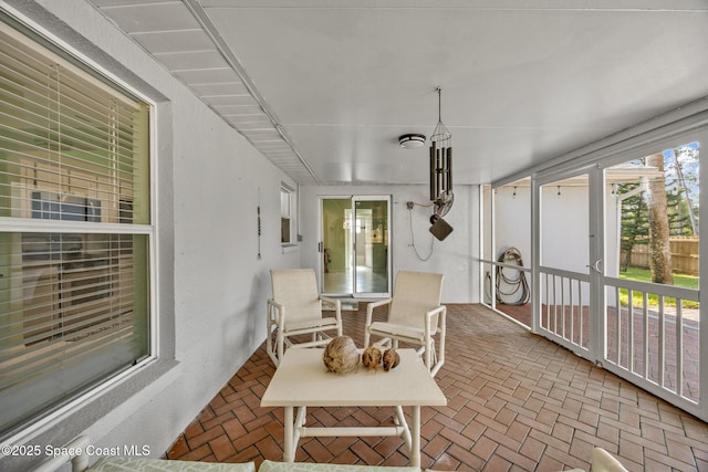 644 Sheridan Woods Dr, Melbourne, FL 32904 - sunroom featuring brick floors