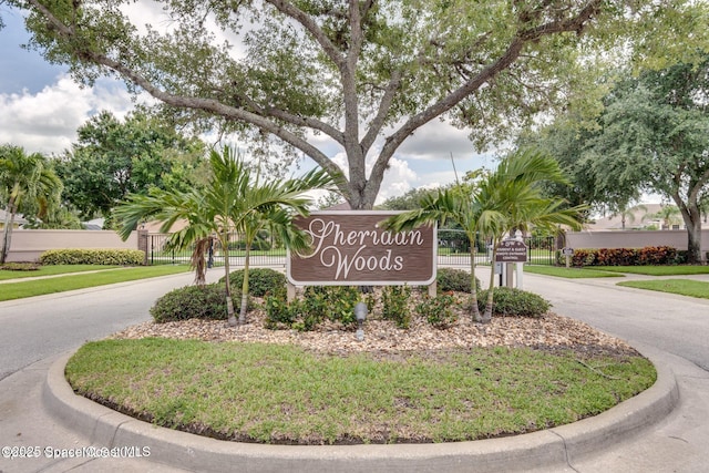 644 Sheridan Woods Dr, Melbourne, FL 32904 - community sign with driveway and fence