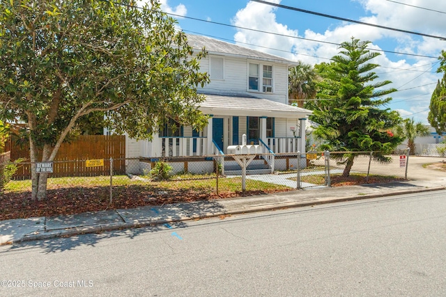 137 Peachtree St, Cocoa, FL 32922 - view of front of home featuring a porch and a fenced front yard