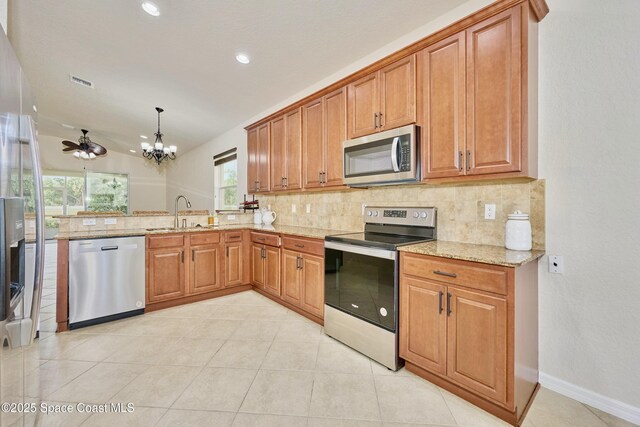 6227 Thames Pl, Vero Beach, FL 32966 - kitchen featuring stainless steel appliances, a sink, decorative backsplash, a chandelier, and recessed lighting