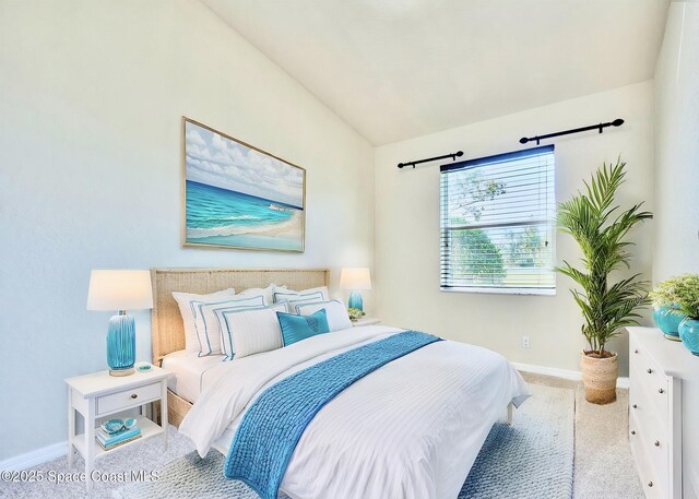 6227 Thames Pl, Vero Beach, FL 32966 - bedroom with baseboards, lofted ceiling, and carpet