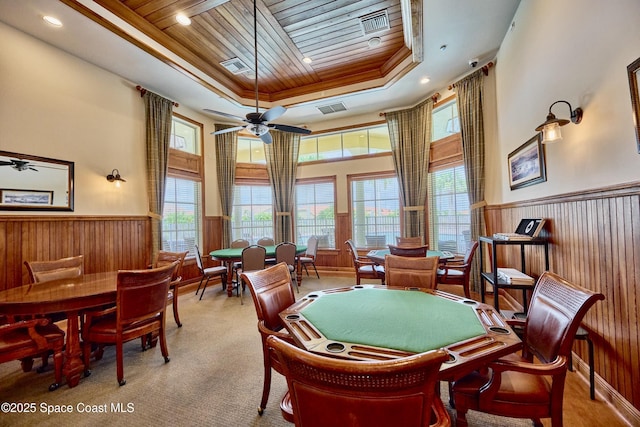 6227 Thames Pl, Vero Beach, FL 32966 - rec room featuring wood ceiling, a ceiling fan, a raised ceiling, plenty of natural light, and a wainscoted wall