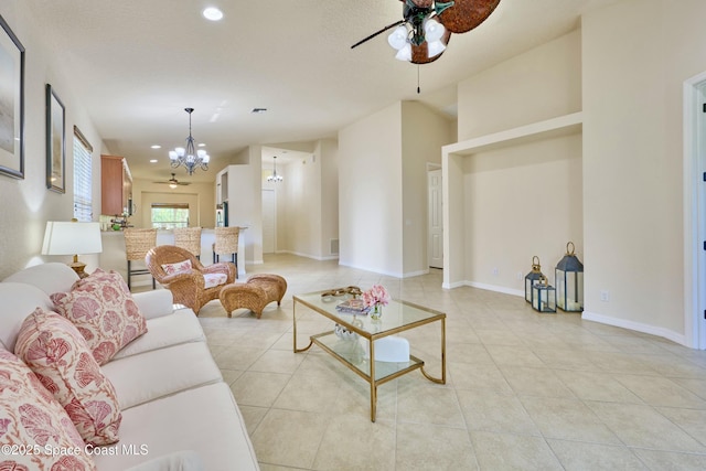 6227 Thames Pl, Vero Beach, FL 32966 - living room with a chandelier, ceiling fan, light tile patterned flooring, recessed lighting, and baseboards