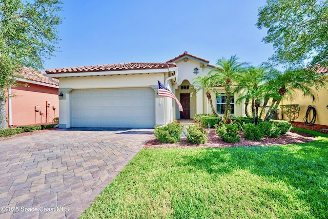 6227 Thames Pl, Vero Beach, FL 32966 - mediterranean / spanish-style home featuring stucco siding, an attached garage, a tiled roof, driveway, and a front lawn