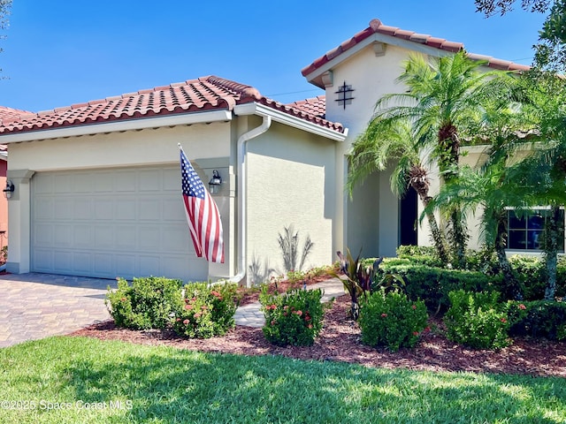 6227 Thames Pl, Vero Beach, FL 32966 - view of property exterior featuring a tiled roof, a garage, stucco siding, and driveway