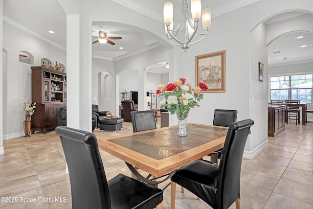 2922 Addison Dr, Melbourne, FL 32940 - dining space featuring a ceiling fan, a chandelier, light tile patterned floors, recessed lighting, and arched walkways