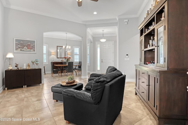 2922 Addison Dr, Melbourne, FL 32940 - living area featuring arched walkways, baseboards, recessed lighting, ornamental molding, and a ceiling fan