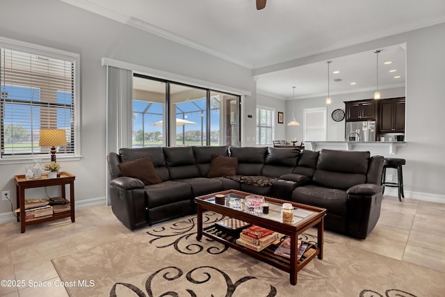 2922 Addison Dr, Melbourne, FL 32940 - living room featuring light tile patterned floors, baseboards, ornamental molding, and healthy amount of natural light