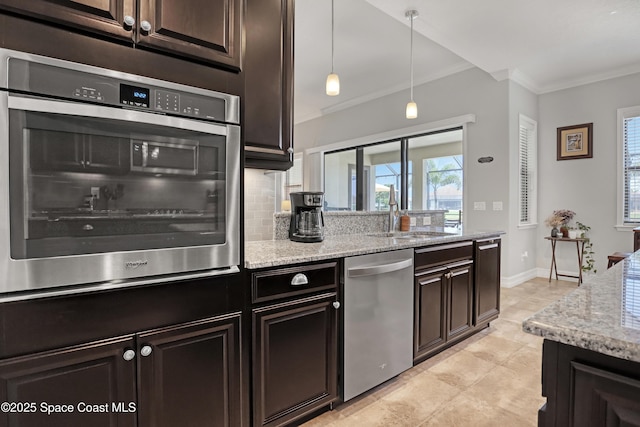 2922 Addison Dr, Melbourne, FL 32940 - kitchen with stainless steel dishwasher, a sink, crown molding, decorative backsplash, and light stone countertops