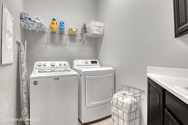 2922 Addison Dr, Melbourne, FL 32940 - laundry area featuring cabinet space and washer and clothes dryer