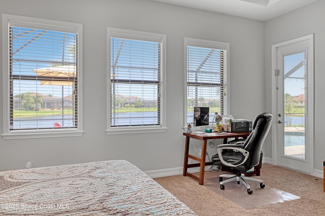 2922 Addison Dr, Melbourne, FL 32940 - bedroom with access to outside, carpet floors, baseboards, and a desk